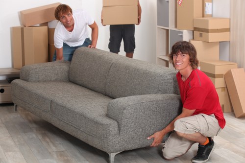 Removalists carefully handling furniture during a Footscray home move
