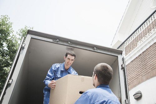 Moving team loading furniture into a van for a Footscray relocation